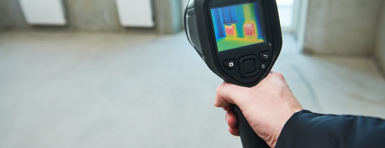 thermal imaging camera inspection of construction building to check temperature and finding heating pipes in floor